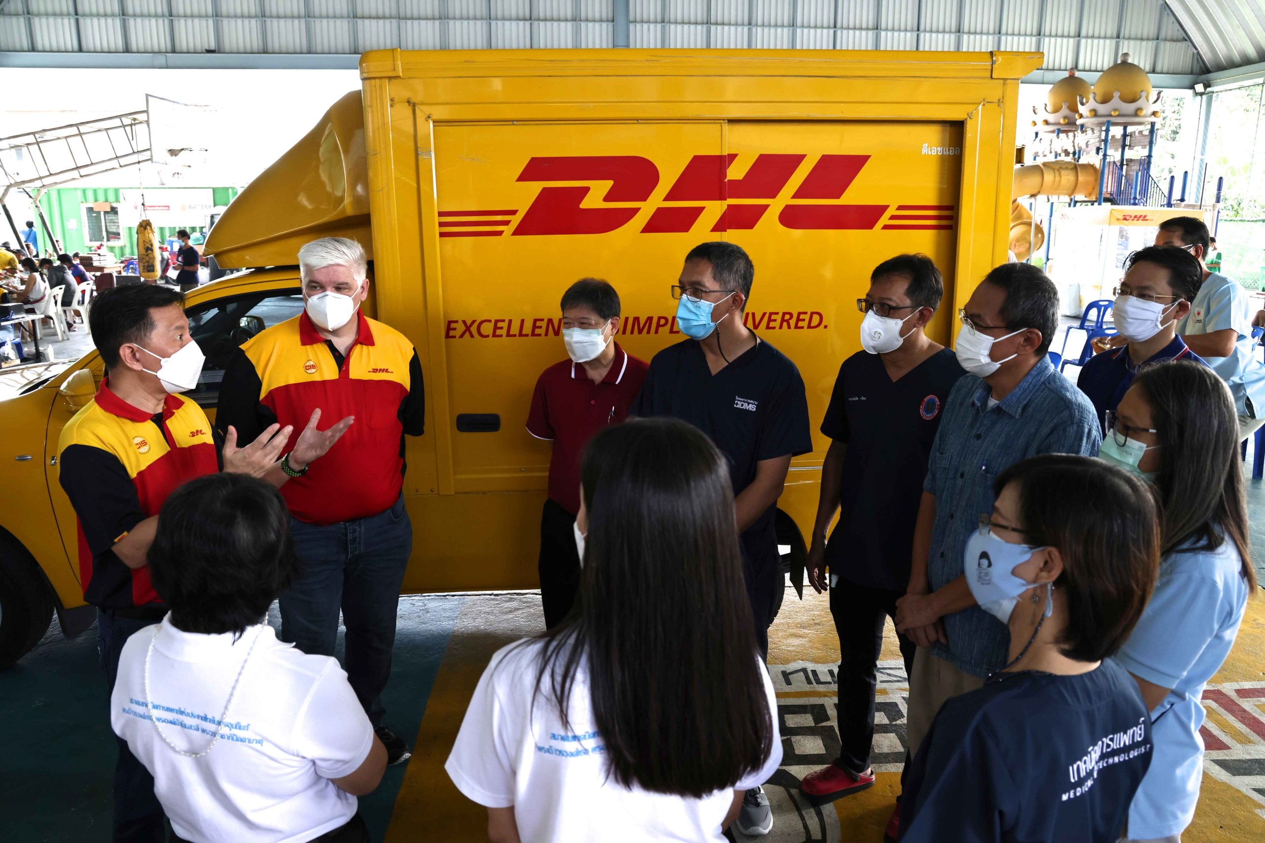 DHL Express management team CoCare founder and representatives from health authorities re 1 scaled